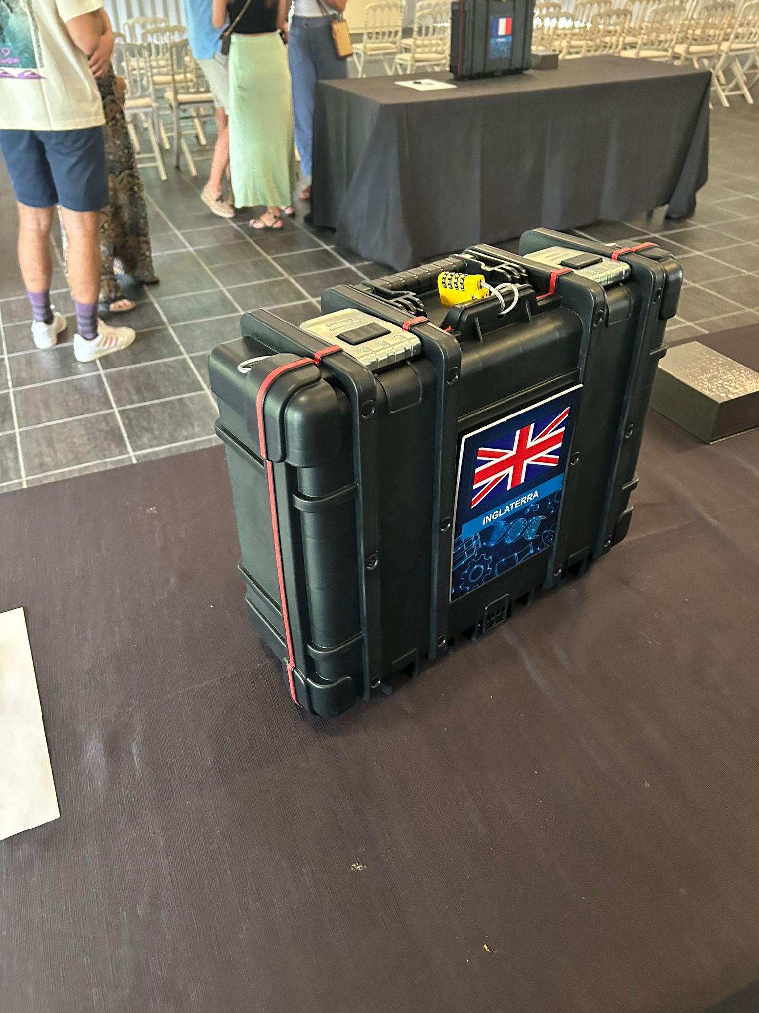 Sealed briefcase with a padlock and the England flag, a prop from the team escape game