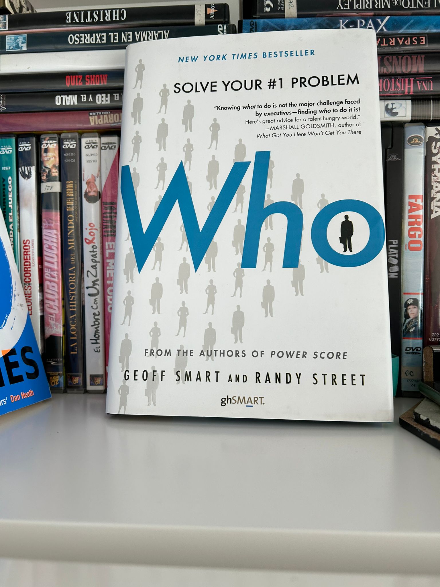 The book Who The A Method for Hiring by Geoff Smart and Randy Street on a shelf