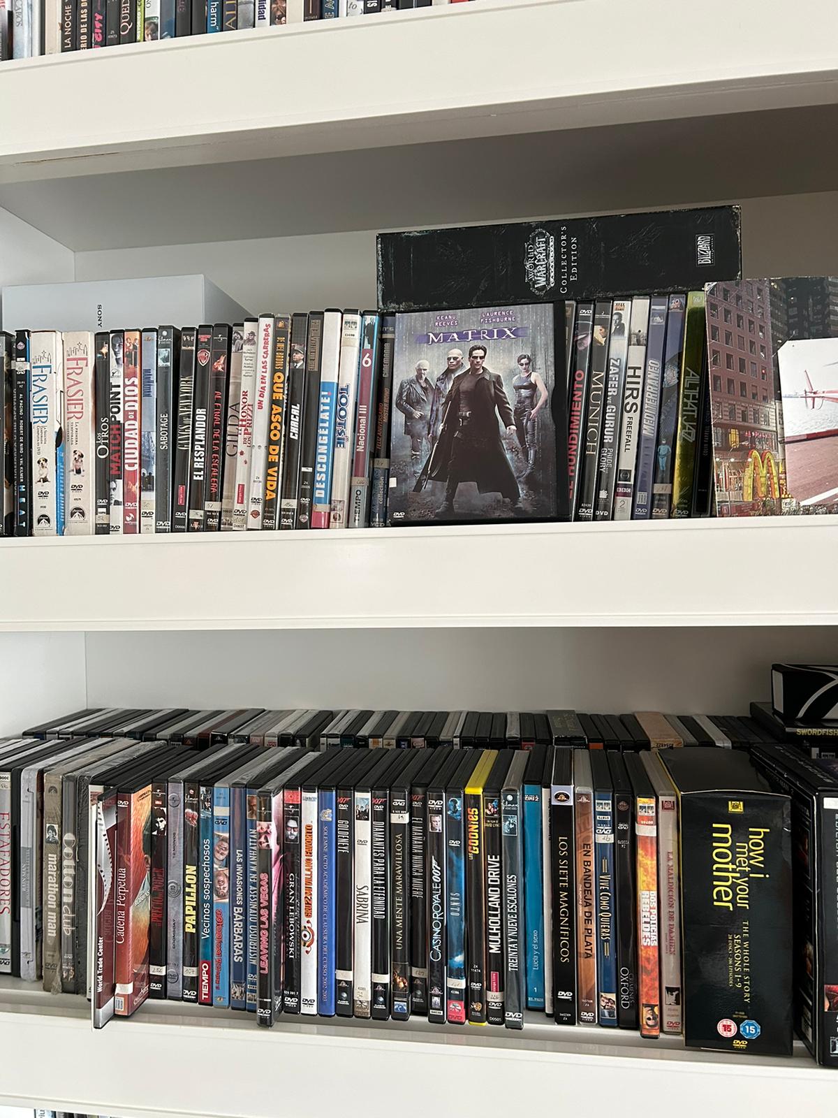 Shelf with a DVD collection where the film Matrix stands out in the foreground