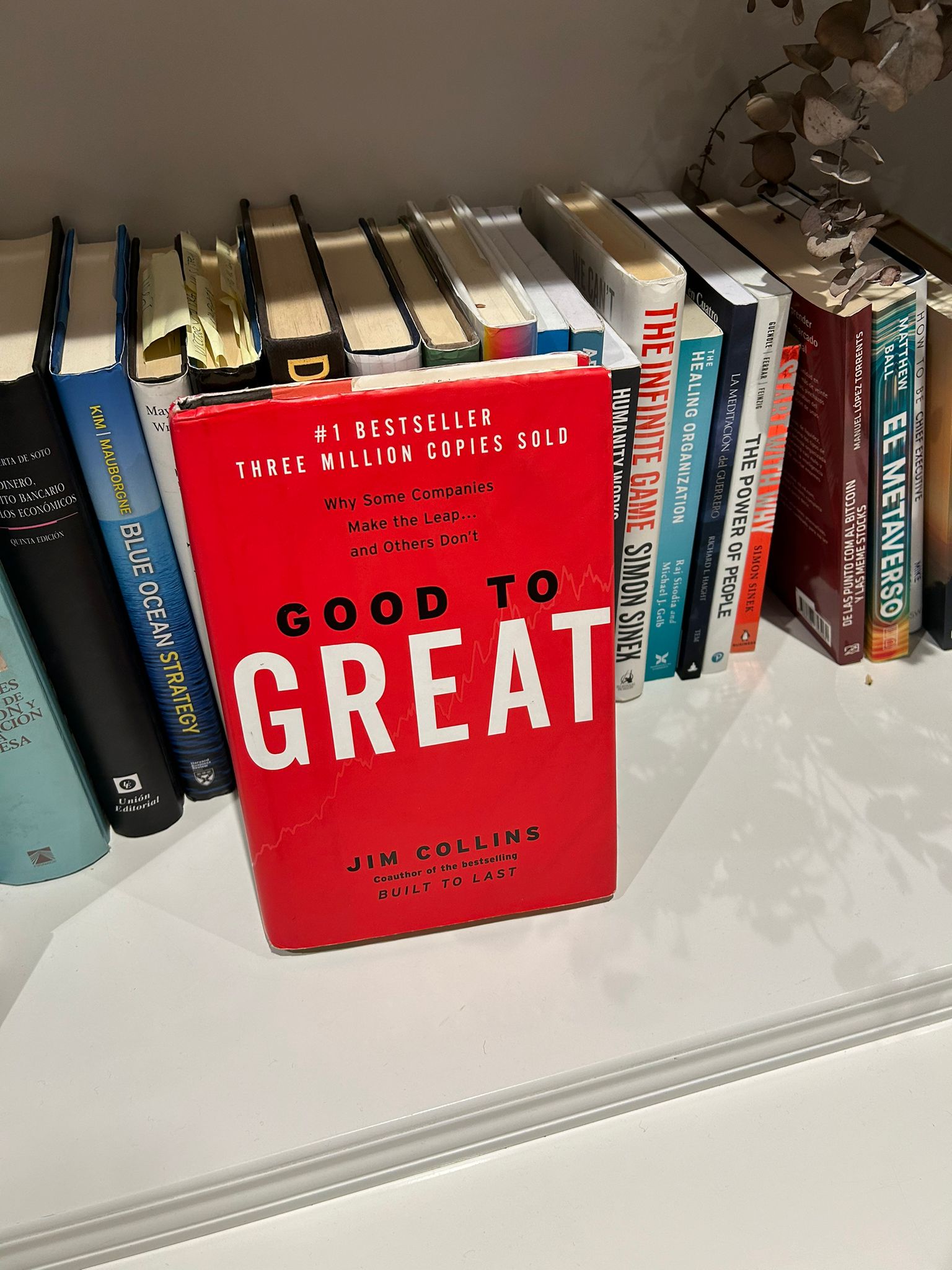 Good to Great by Jim Collins, with its red cover, sitting on a bookshelf