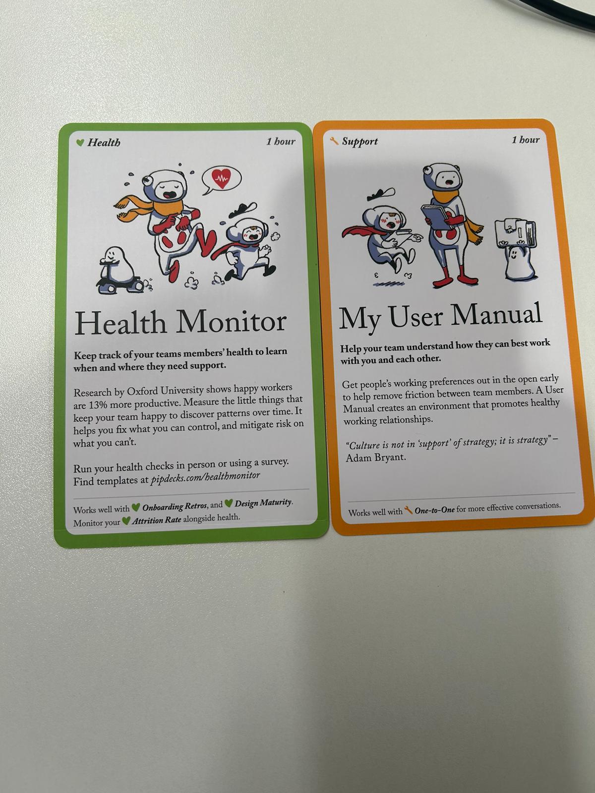The Health Monitor and My User Manual cards from the Team Tactics deck with their text in English