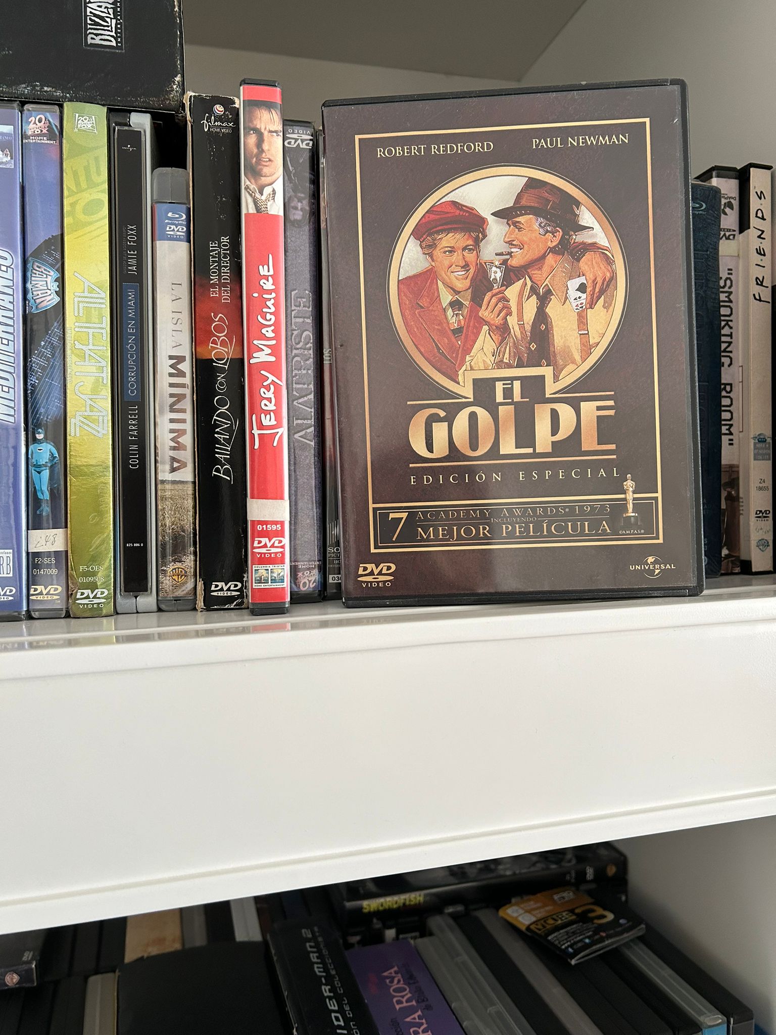 DVD cover of the film The Sting with Robert Redford and Paul Newman on a shelf