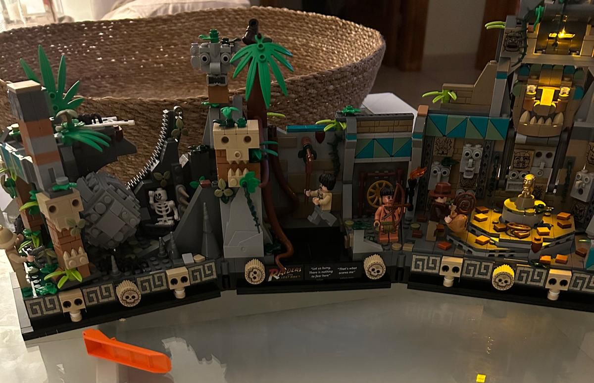 LEGO model of the Indiana Jones Temple of Doom with jungle, skulls and minifigures
