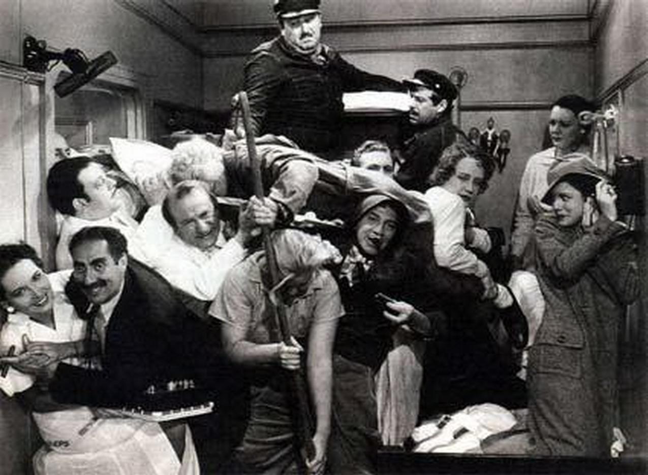 The crowded stateroom scene from A Night at the Opera with Groucho Marx and a crowd packed in