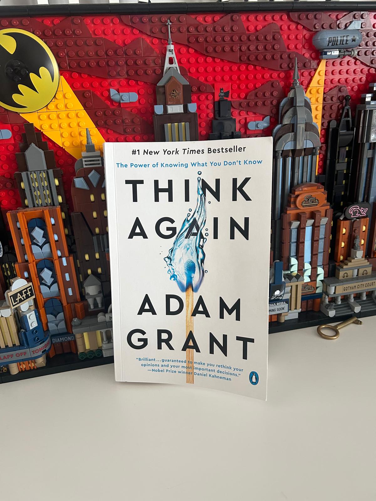 Adam Grant's book Think Again next to a Lego model of Gotham City with the Batman logo