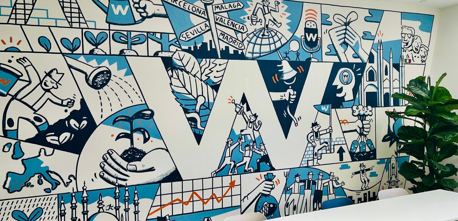 Blue and white mural in the W Executive office with the giant W and scenes from its history