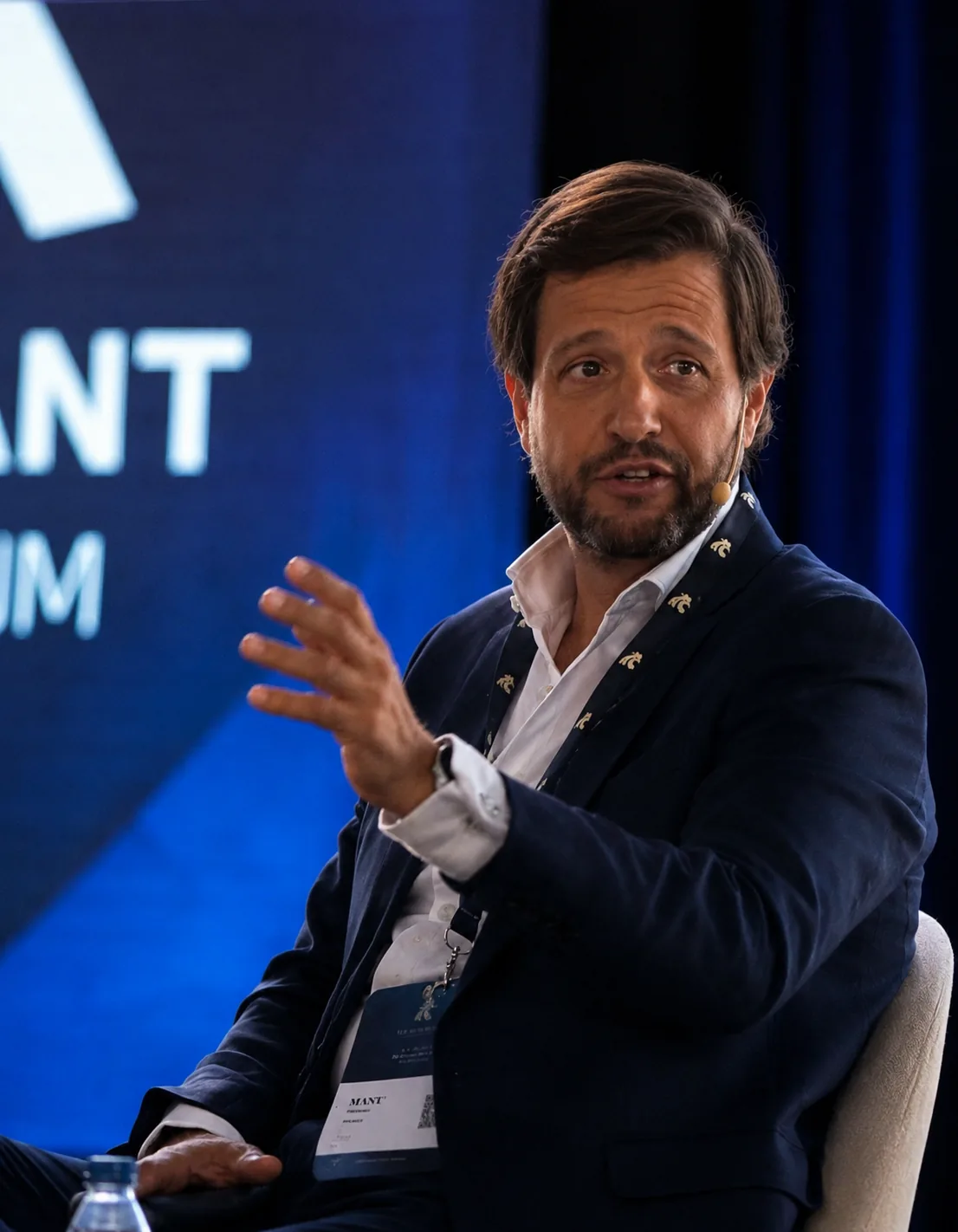 Manu Soriano speaking on a panel at a conference